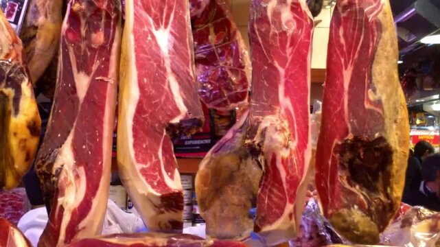 Traditional Spanish Jamon Iberico Hanging in a Local Market