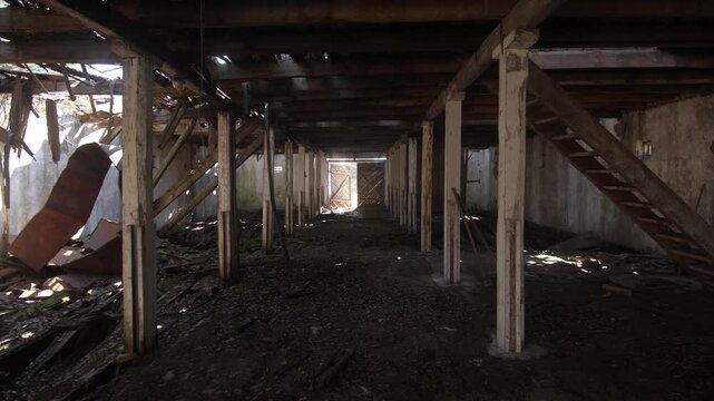 Dark Undercroft With Timber Supports, Scattered Wood And Mossy Floor, Distant Door Framed By Daylight, Shafts Of Light Through Broken Boards, Abandoned Industrial Shelter Mood