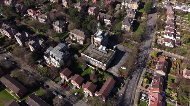 4K drone footage showing Birkenhead Merseyside with neighbourhood housing surrounded by greenery.