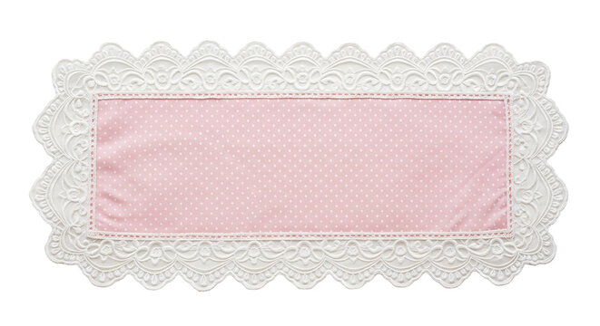 Pink polka dot rectangular doily with white lace trim.