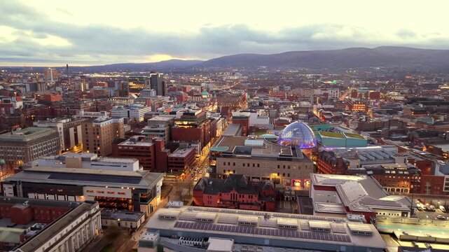 Advancing 4K 60FPS aerial GV of Belfast City Centre in Northern Ireland at night. Produced with Rec709 color.