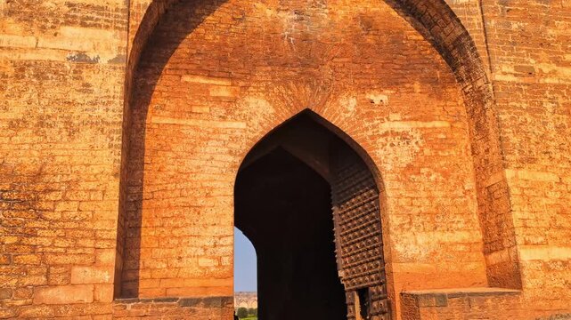 Bidar fort Gumbad Darwaza entrance with sky at karnataka, india. day time, tilt down shot, 4k.