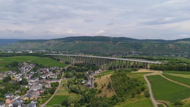 Moselle Viaduct Longuich, vineyard in Mosel valley, bridge of highway crossing river near Trier, german autobahn, aerial view