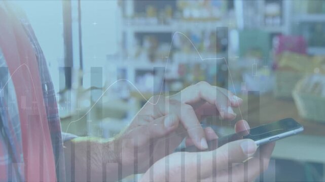 Animation of statistical data processing over mid section of a man using smartphone at a store