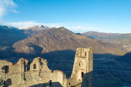 View of "Val di Susa" (Susa Valley), Piedmont, Italy, from the famous Sacra di San Michele (Sain Michael Abbey). Old ruins in the foreground. Hills and italian alps on the background.