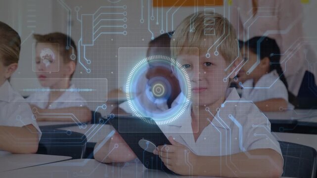 Boy holding tablet in class tapping and activating circuit HUD with rotating reticle for learning