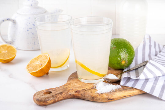 Healthy homemade Electrolyte Drink made with salt, sugar, citrus fruit (lemon and lime) juice. Sport isotonic beverage for good hydration