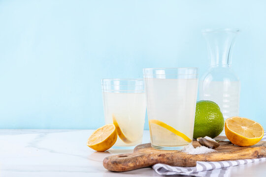 Healthy homemade Electrolyte Drink made with salt, sugar, citrus fruit (lemon and lime) juice. Sport isotonic beverage for good hydration