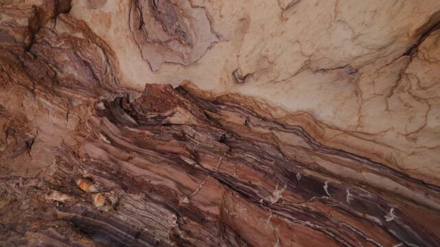 The walls of the salt cave on Qeshm Island with textured mineral walls and crystalline. Unique geological landscape and underground travel destination. one of the seven wonders of the Persian Gulf.