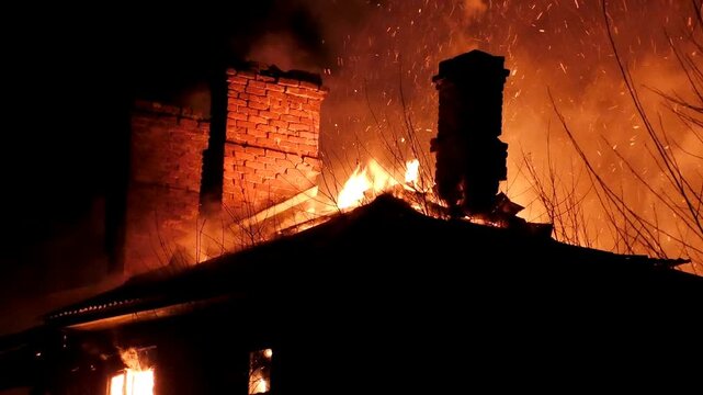 The house is on fire. A scary video of a burning dwelling.