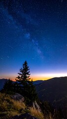 Fototapeta premium Night sky over mountains with Milky Way