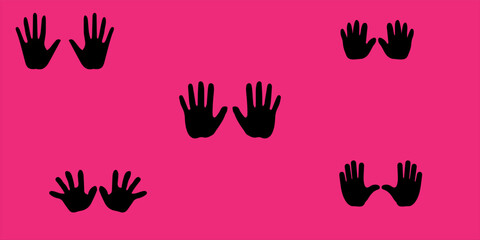 Fototapeta premium Black handprint silhouettes on a vibrant pink background.