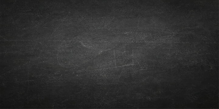 A blank vintage blackboard with chalk on a dark grunge concrete wall texture creates an empty grey stone surface backdrop for a textured chalkboard design pattern