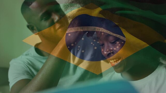 Animation of flag of brazil over african american father with daughter
