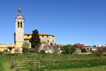 Fototapeta premium village and Sant Esteve Church, Riudellots de la Selva, Girona province, Catalonia, Spain