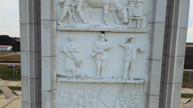 Kursk battle memorial obelisk in Prokorovka field, Belgorod oblast of Russia, with images of warriors and historic figures (by V. Klykov, 1995).
