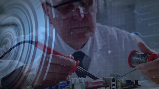 Senior electronics tech soldering components at workbench, with holographic grids floating