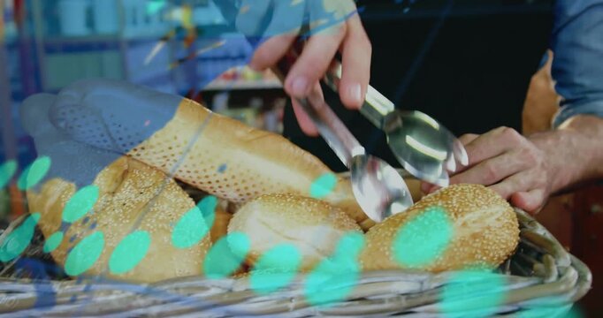 Sesame bread basket being rendered in 3D, with denim sleeve hand using metal tongs selecting loaf
