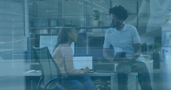 Woman typing business data on laptop, coworker approaching presenting tablet chart for analysis