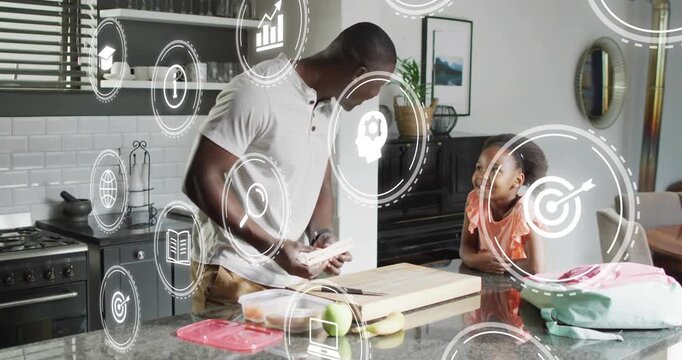Father preparing sandwich, packing lunch for school while daughter watching, icons overlaying frame