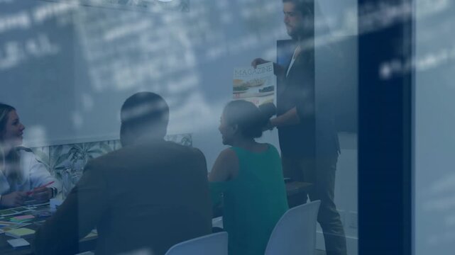 Vertical video: Lead lifting package, pointing and turning, drawing team into design chat via glass