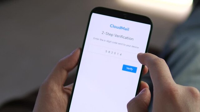 Close-up of a user entering a 6-digit security code for 2-step verification on a mobile app. Secure login process for cloud mail authentication. Essential footage for cybersecurity, digital privacy