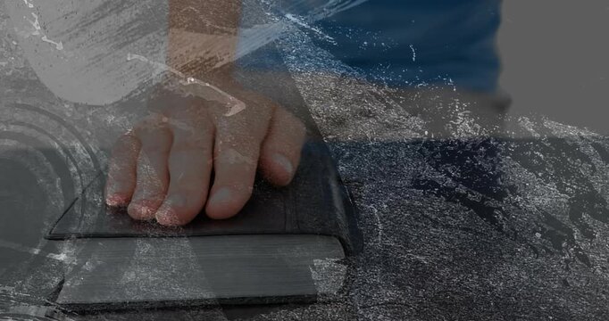 Child hand placing on books, pressing, shifting fingers, holding steady, grain obscuring learning