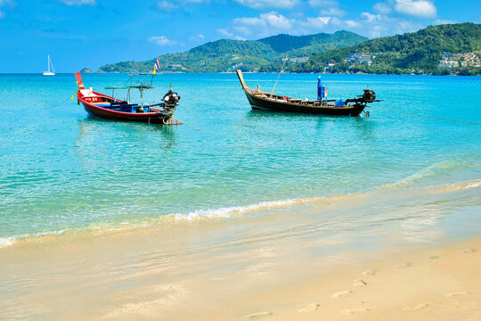 Phuket-Patong beach-August 25,2023:The unidentified people are relaxing on Patong beach during a sunny day in Phuket, Thailand. Patong is one of famous beach located in the west coast of Phuket