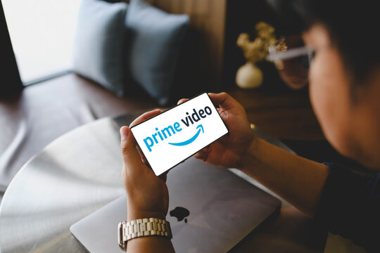 Bangkok, Thailand. April 9, 2026; An over the shoulder shot of a person holding a smartphone horizontally displaying the Amazon Prime Video logo on the screen.