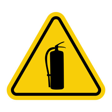 Fire extinguisher. Yellow warning sign. Indicates the location of the fire extinguisher. Increased fire safety. A yellow triangular sign with a black fire extinguisher symbol inside.