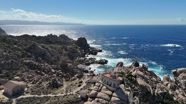 High Altitude Orbital Drone Flight Over Lighthouse and Rocky Coast in Cala Francese, Capo Testa