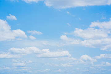 Obraz premium Beautiful soft blue sky with white clouds.