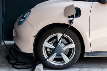 Fototapeta premium Close-up of an electric car charging, representing clean energy and sustainable transportation technology.
