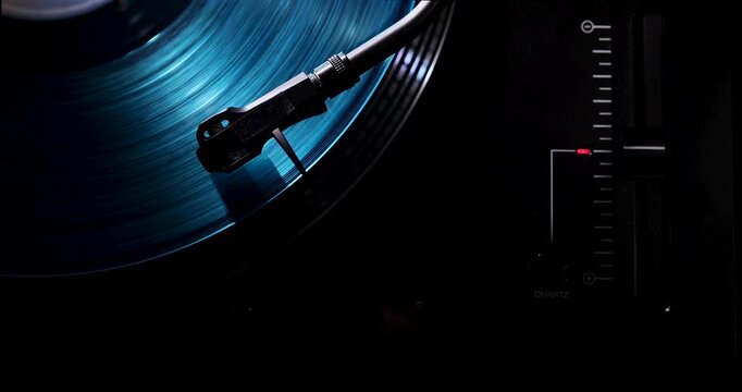 Cinematic top view of a blue vinyl record spinning on a professional turntable, creating a luxury and contemporary music atmosphere.