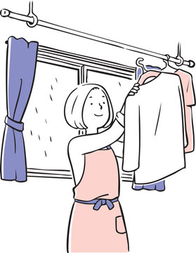 雨の日に室内干しをするお母さん_2色