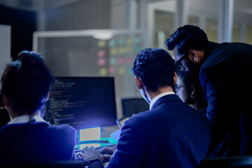 Cybersecurity analysts executing threat mitigation protocols in security operations center. IT...