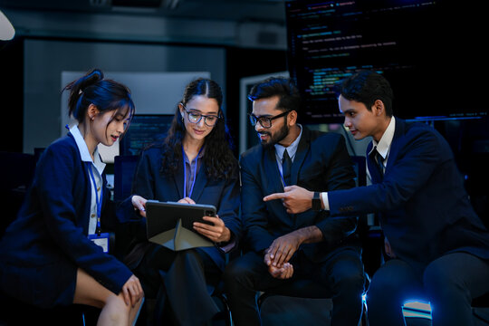 Agile scrum team conducting sprint retrospective meeting in modern tech office. DevOps engineers discussing microservices architecture scalability strategies.