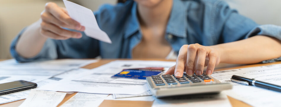 Financial household debt concept, stressed young asian woman trying to find money to pay credit card debt.