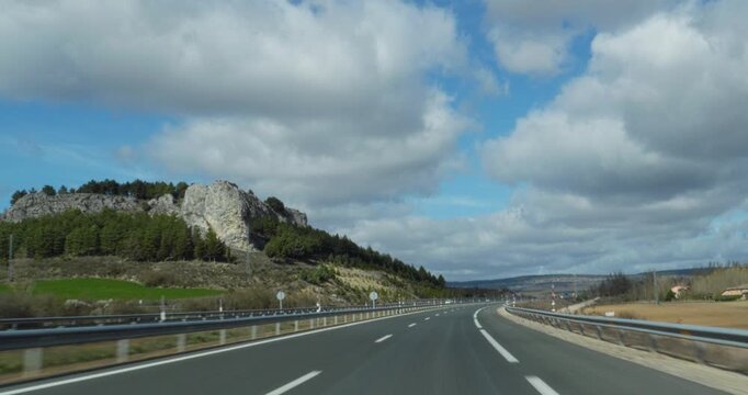 Car POV Driving down the roads of Spain in a cloudy afternoon in Spain