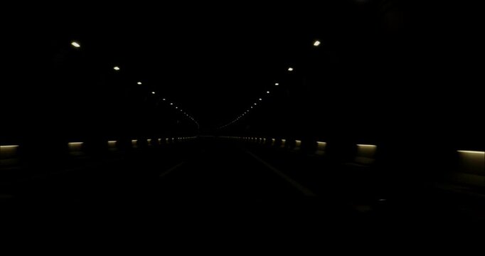 POV Driving through a tunnel in the road