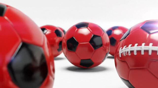 Realistic glossy red and black football soccer ball set isolated on white background. Professional sport equipment design elements with shiny leather texture and sharp detail.