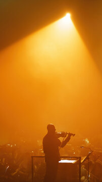 Silhouette Performing on Stage with Orchestra. AI generative.