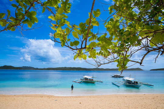 Pristine White Sand Beach with Traditional Bangka Boats in Palawan, Philippines