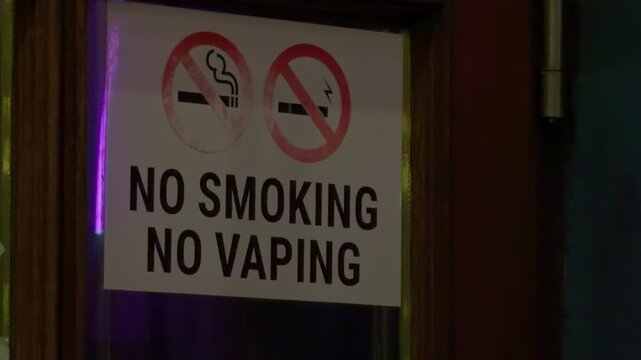 No smoking no vaping decal on glass frame venue restriction