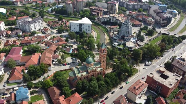 From above, a slow drone rotation uncovers the historic town of Paracin nestled in central Serbia.