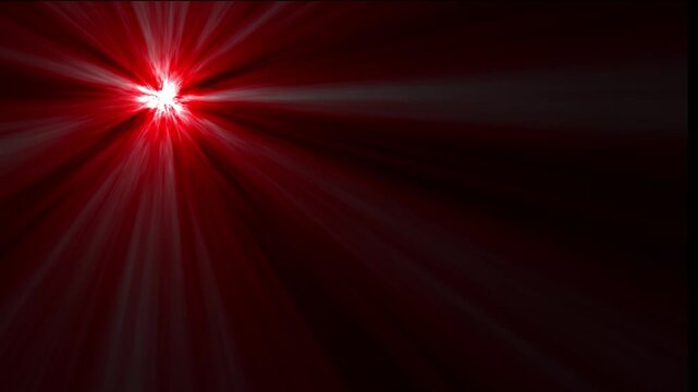 Intense red starburst light effect with radiating beams of light emanating from the upper left corner against a dark red background with subtle gradient and vignetting effect