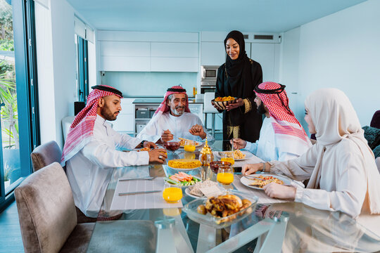Arab family enjoying traditional meal together during ramadan