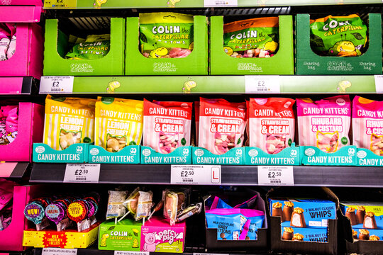 Bags of Popular Sweets on Supermarket Shelf Colin the Caterpillar Candy Kittens and Percy Pig