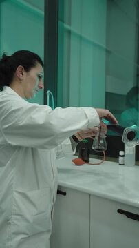 Winery, wine production. Quality control. winemakers laboratory testing wine in winery lab. Measurement alcohol content cold stability density malic acid red grape color sugar sulfur dioxide 