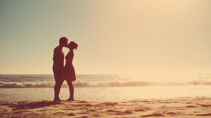 Fototapeta premium Romantic love theme for Valentines Day. A man and woman embracing and kissing on the beach at sunset. The sky is painted in a gradient of orange and pink hues.